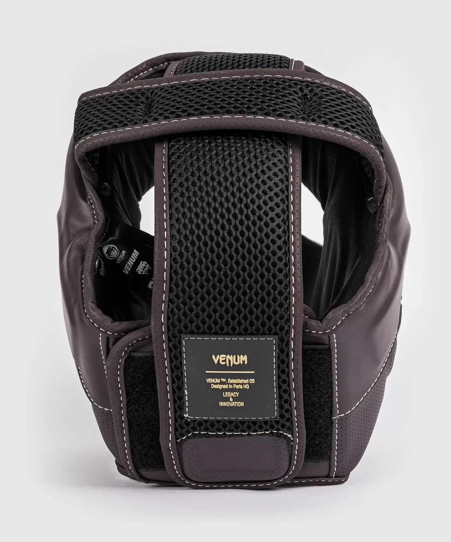 Venum Impact Evo chocolate brown boxing headgear with premium Skintex leather and adjustable strap.