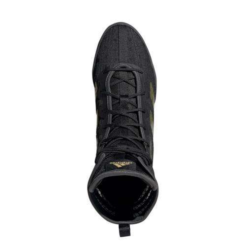 Top view of black Adidas Box Hog IV boxing shoe with gold accents and high ankle support