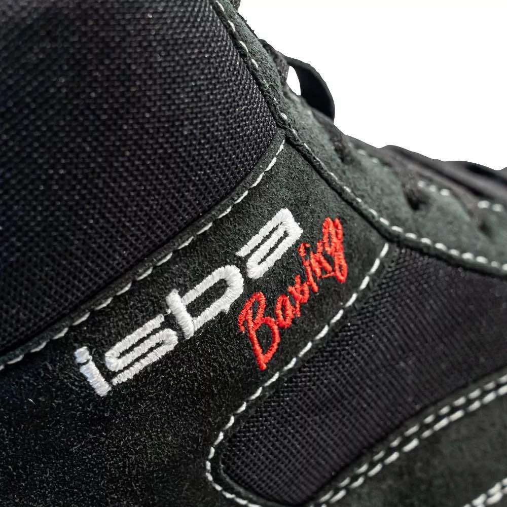 Close-up of black ISBA Fighter children's savate boxing shoes with embroidered logo and detailed stitching