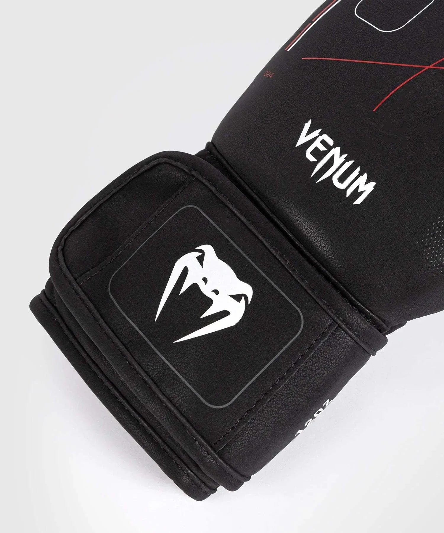 Close-up of black and red Gants de Boxe Venum Tactical XT boxing glove with Venum logo and wide velcro wrist strap