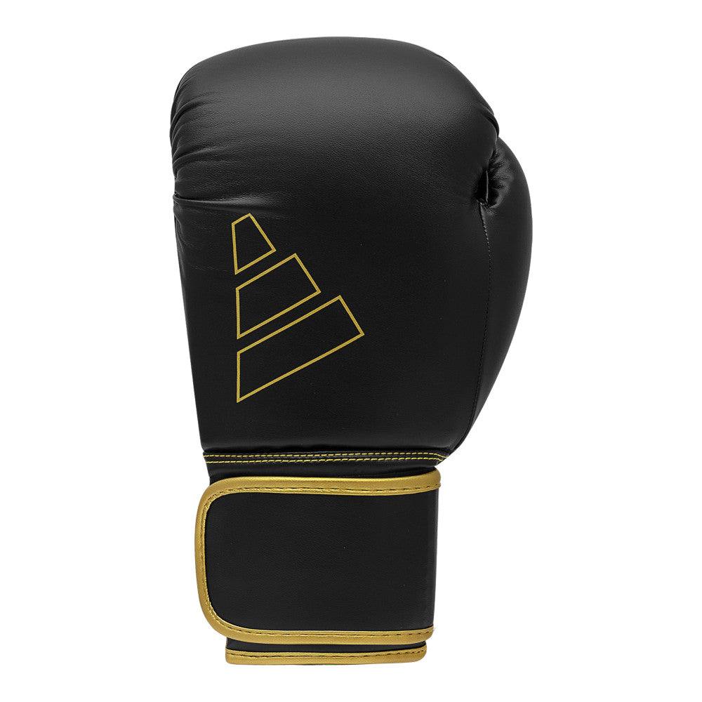 Black and gold Adidas Hybrid 80 boxing glove with secure Velcro strap and durable PU material