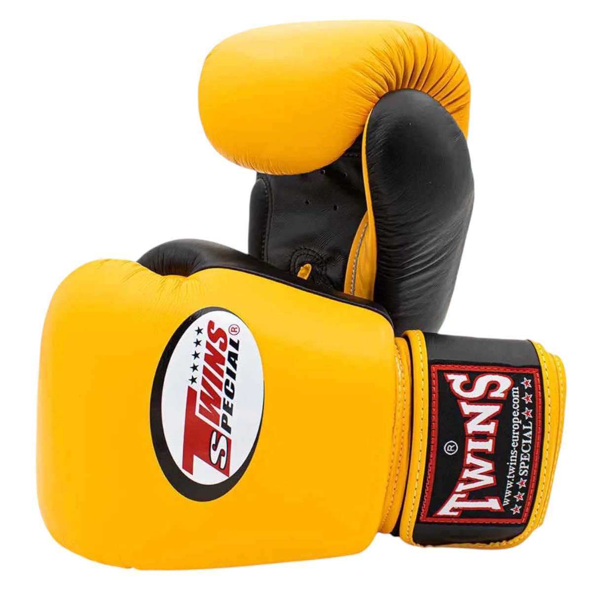 Yellow and black Twins Classic boxing gloves made of premium Thai buffalo leather with multi-layer foam for optimal hand protection
