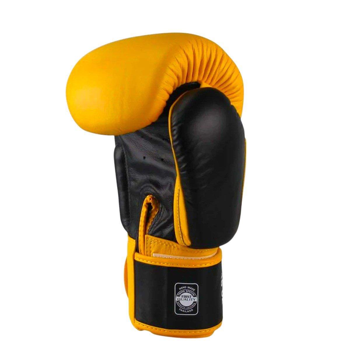 Yellow and black Twins Classic boxing glove made of premium Thai buffalo leather with reinforced palm and wide wrist closure for optimal hand protection.