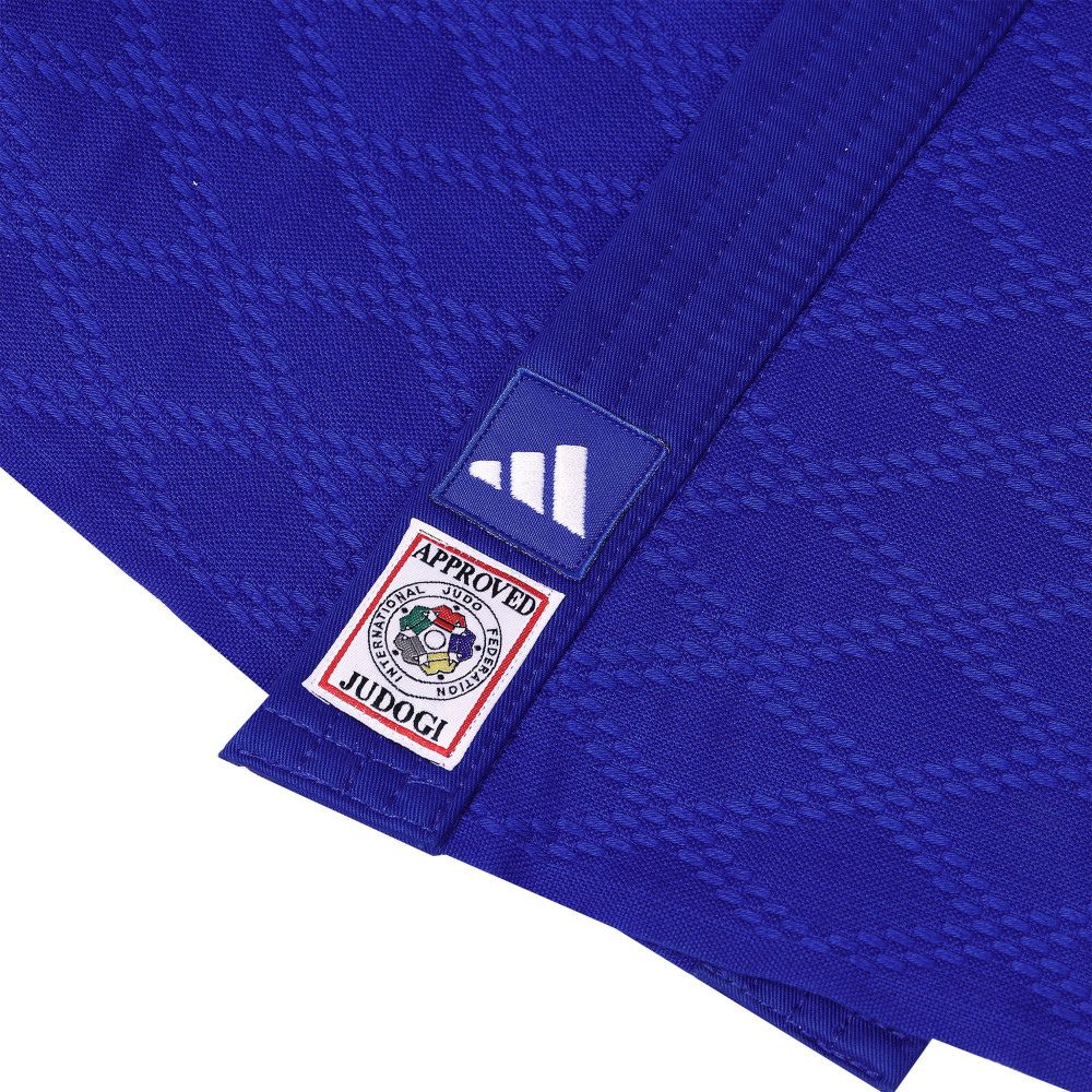 Close-up of blue Adidas Kimono de Judo Champion III with IJF approved patch and textured fabric detail