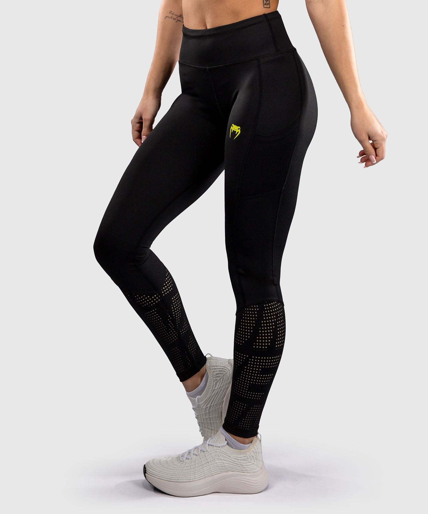 Legging Venum Lazer pour femme noir et jaune, compression et maintien optimal pour entraînement MMA et grappling