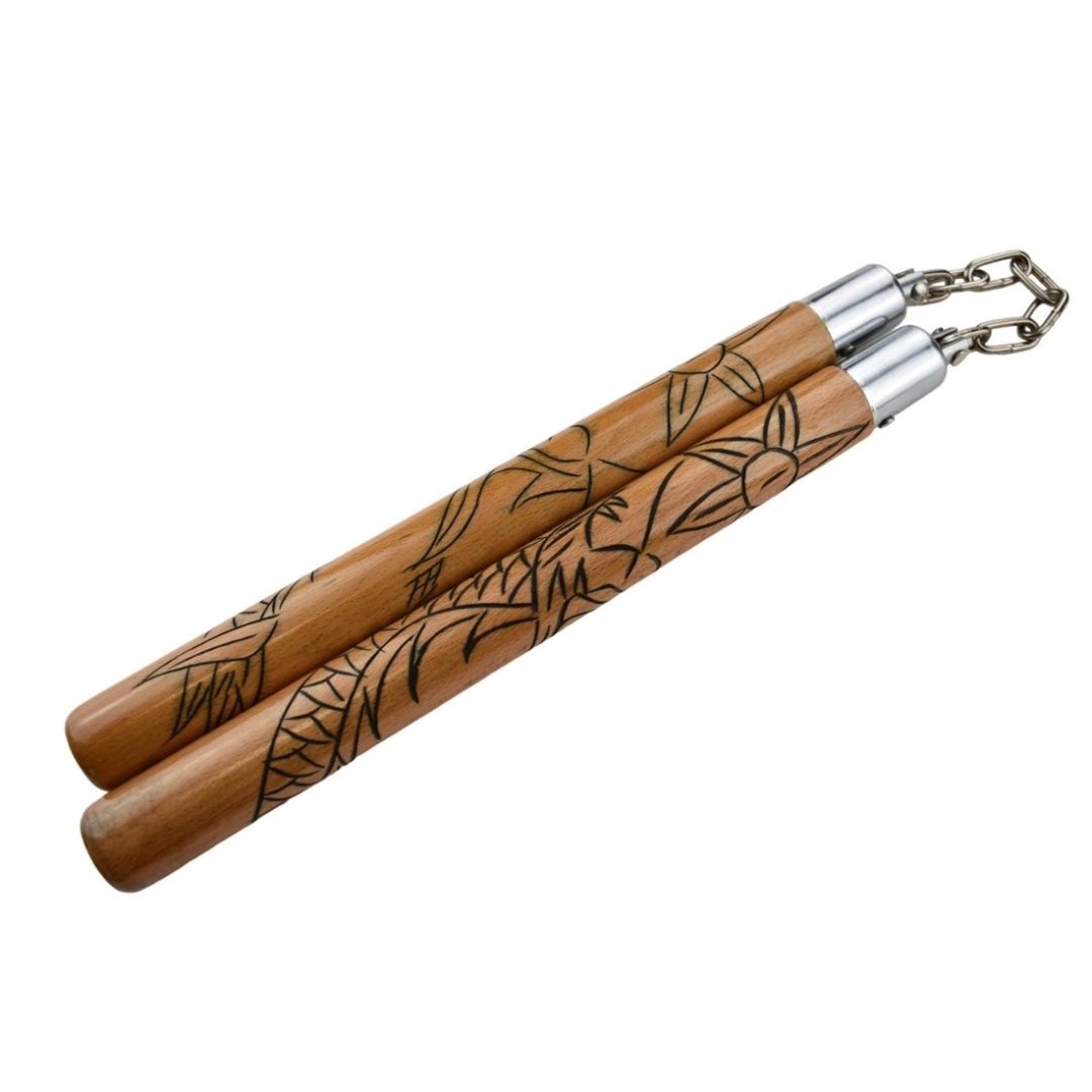 Traditional nunchaku made of 30 cm beech wood with engraved dragon design and round chain for martial arts training