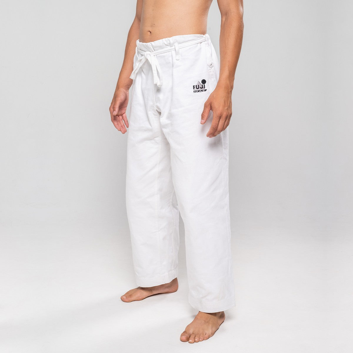 White FUJIMAE Legacy II karate pants made of 100% brushed cotton with reinforced ventilation and a tailored fit for optimal comfort and durability
