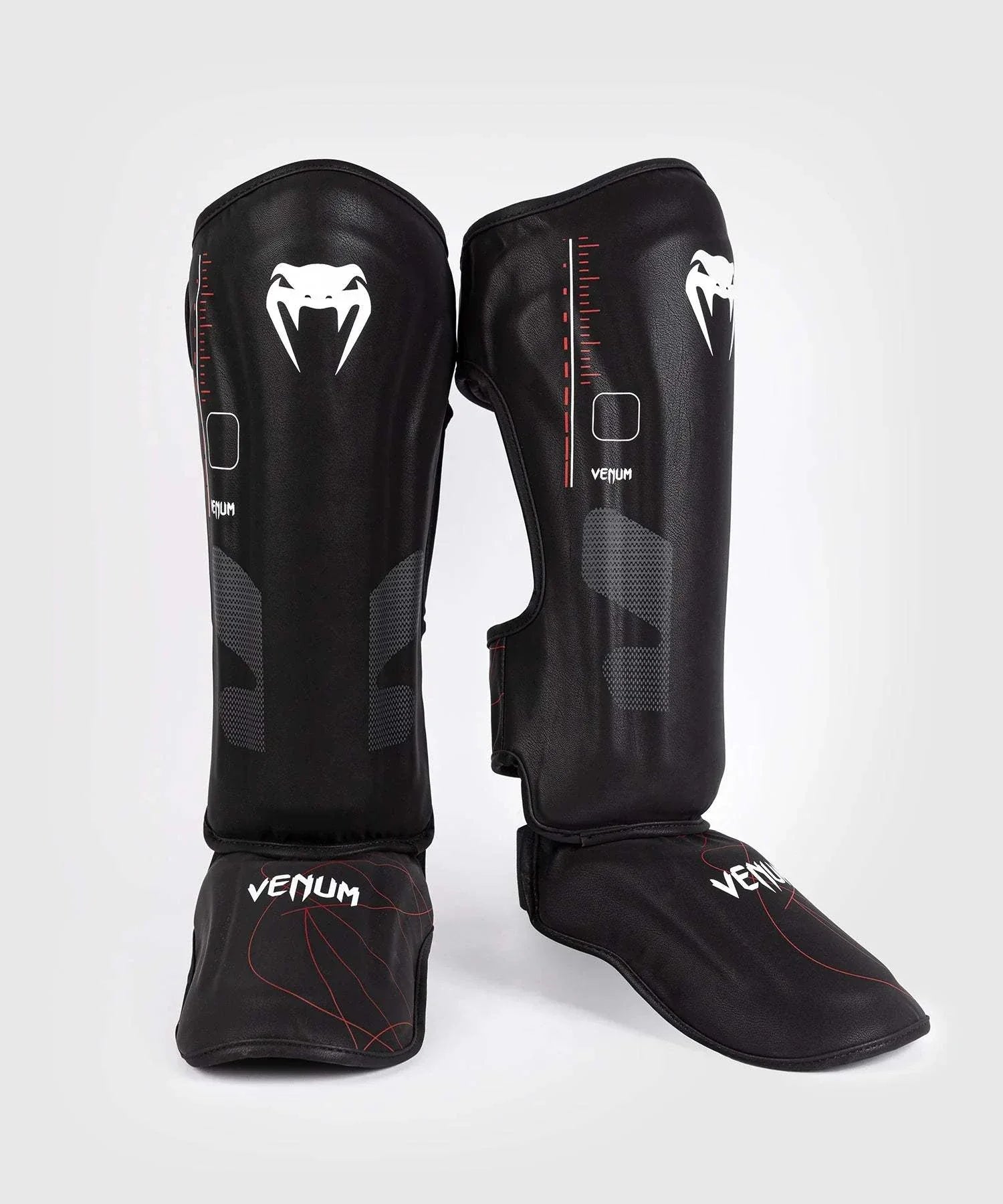 Black and red Venum Tactical XT shin and foot guards with multi-density foam and velcro straps for martial arts protection