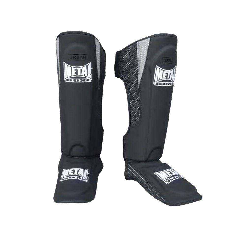 Black Protège Tibia-pieds Urban shin and foot guards with Metal Boxe branding for lightweight, comfortable protection in martial arts.