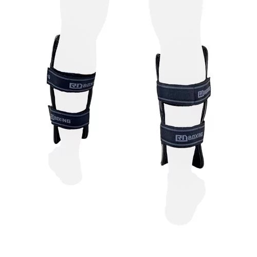 High-density black RD BOXING V5 shin guards with double velcro straps for advanced combat training and sparring protection