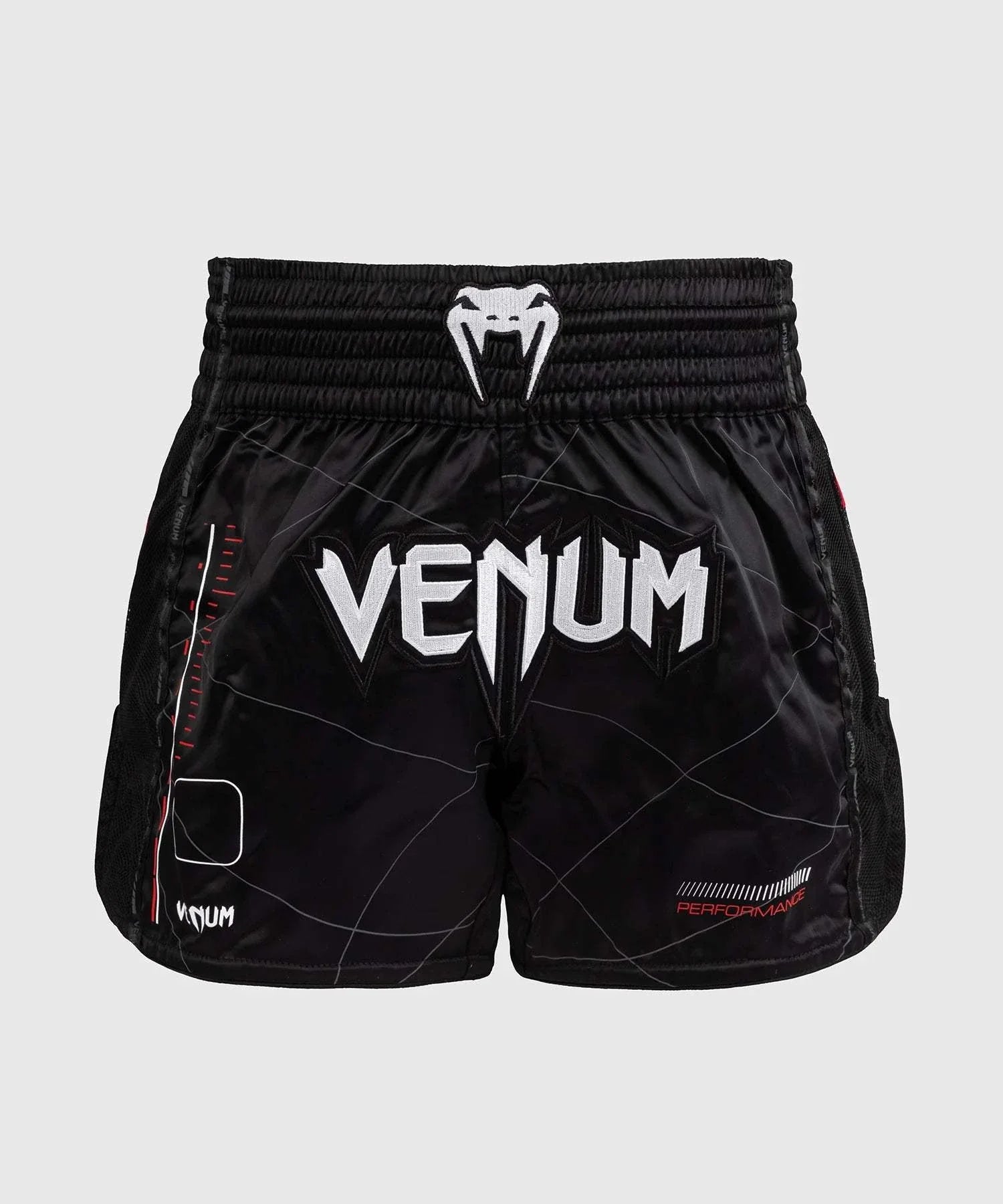 Black and red Venum Tactical XT Muay Thai shorts with logo and elastic waistband for performance and durability