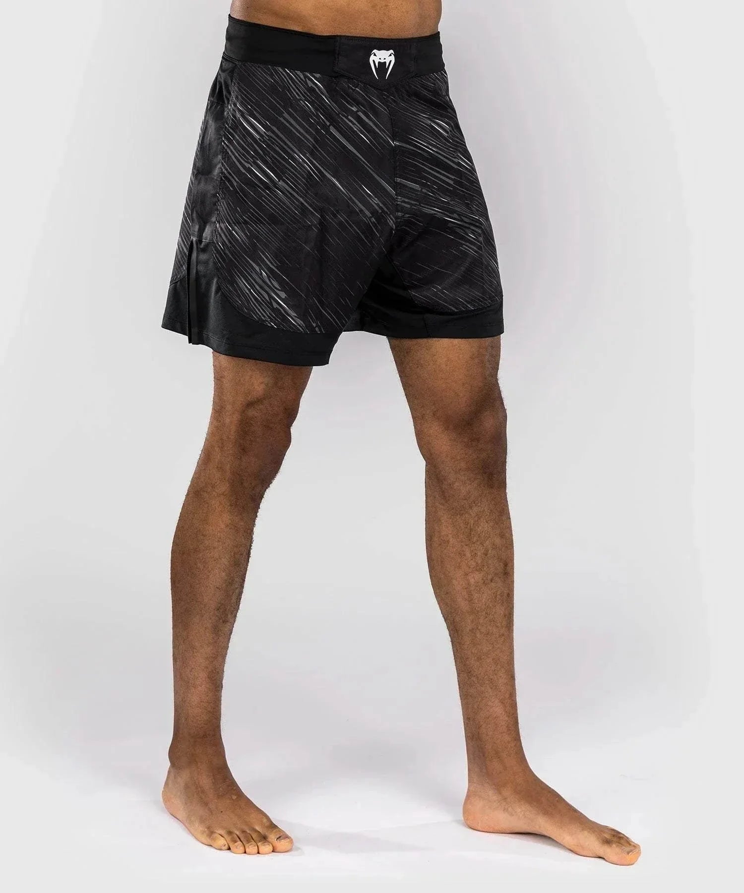 Black and gray Venum Rapid fight shorts with lightweight ripstop fabric and ergonomic cut for MMA training