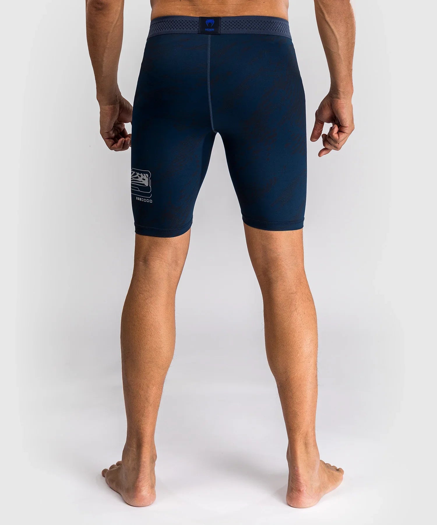Back view of navy blue compression shorts from UFC Fusion par Venum collection designed for MMA training and performance