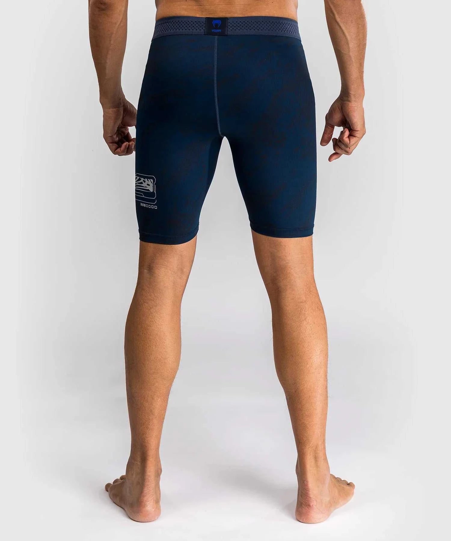 Back view of navy blue compression shorts from UFC Fusion par Venum collection designed for MMA training and performance
