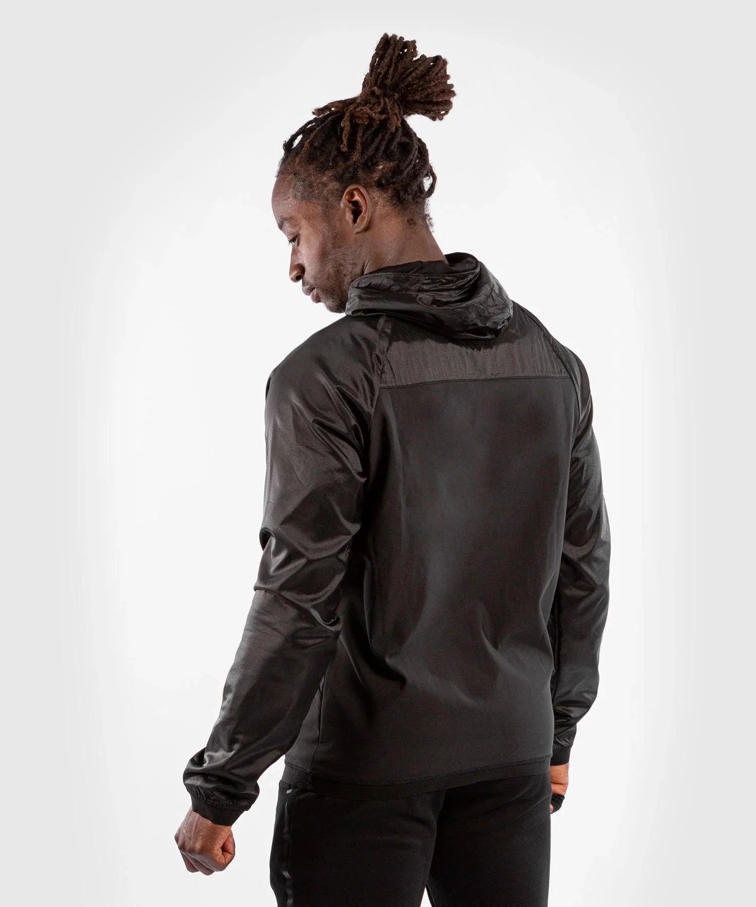 Black Venum Laser XT hoodie with adjustable hood and waterproof fabric worn by male model from back view