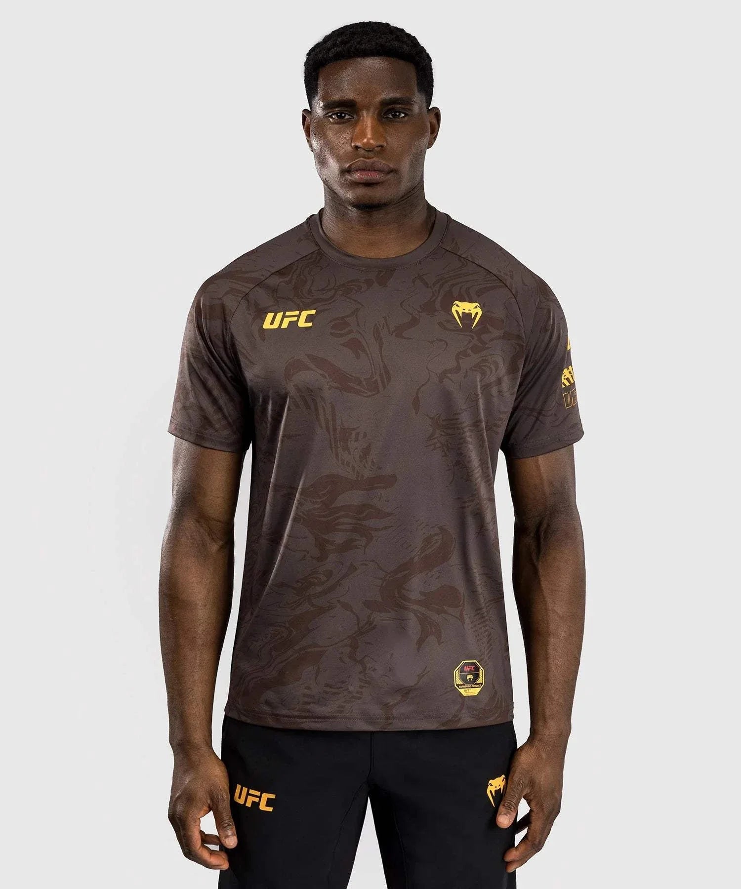 Men's UFC Fusion Venum Dry-Tech performance T-shirt in dark color with yellow logos and short sleeves