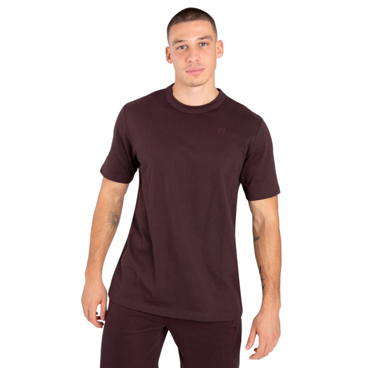 Man wearing brown Venum Silent Power t-shirt with short sleeves and round neck, featuring subtle tonal logo on chest.