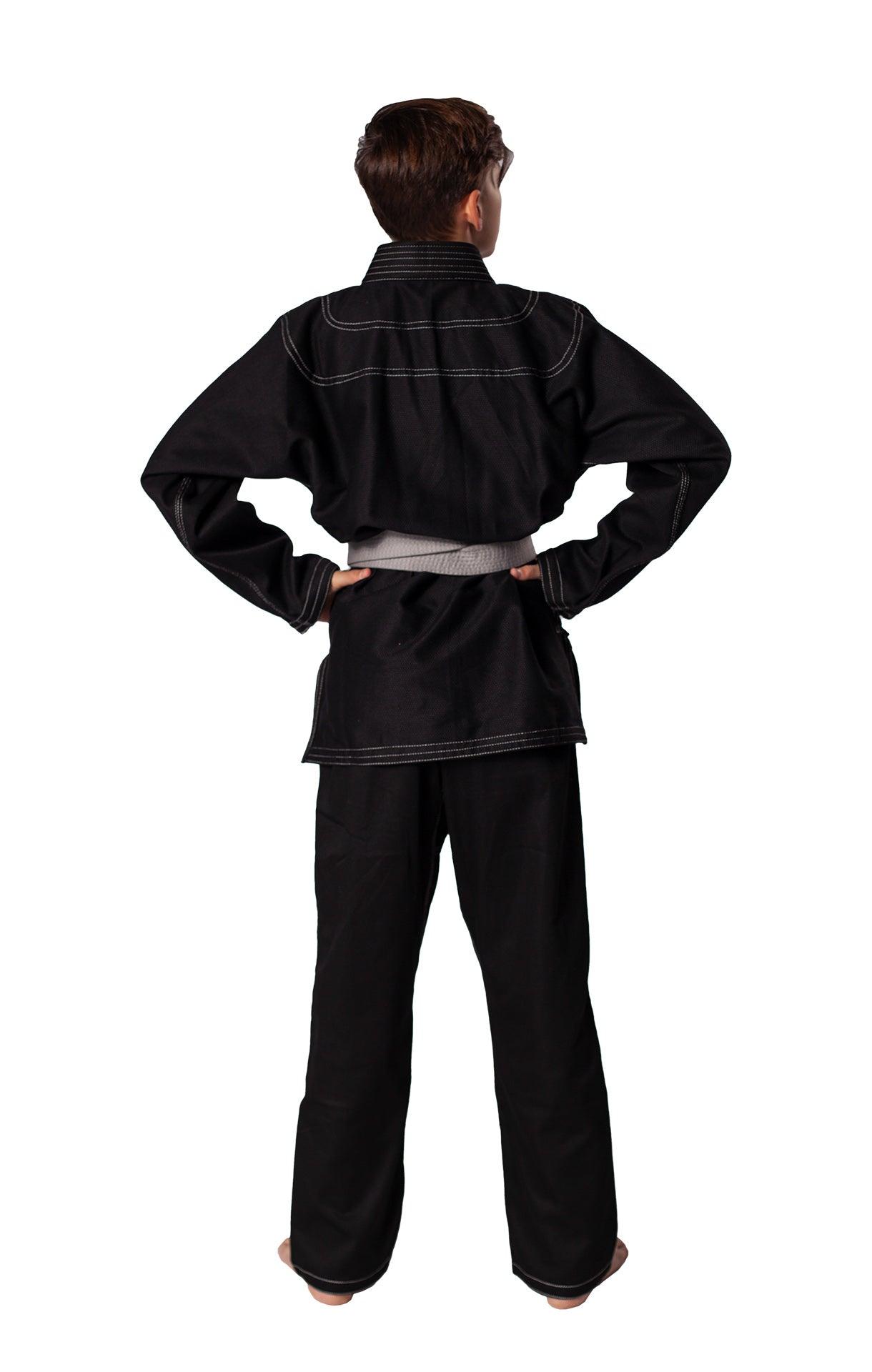 Child wearing black Danrho Brazilian Jiu Jitsu kimono from the back