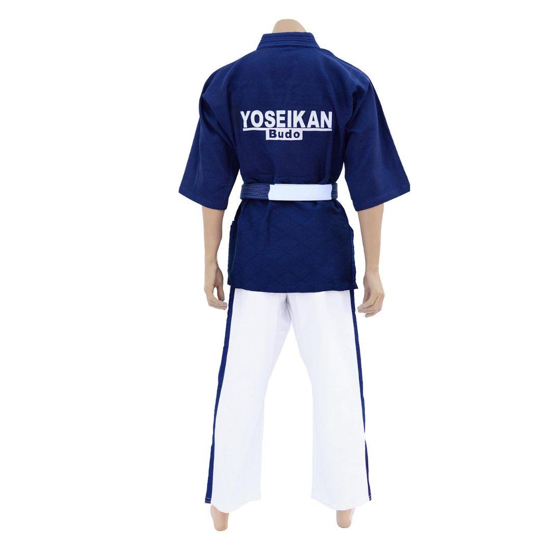 Back view of Kimono de Yoseikan Budo Master with navy blue rice grain jacket and white pants with blue stripes, featuring embroidered logo.