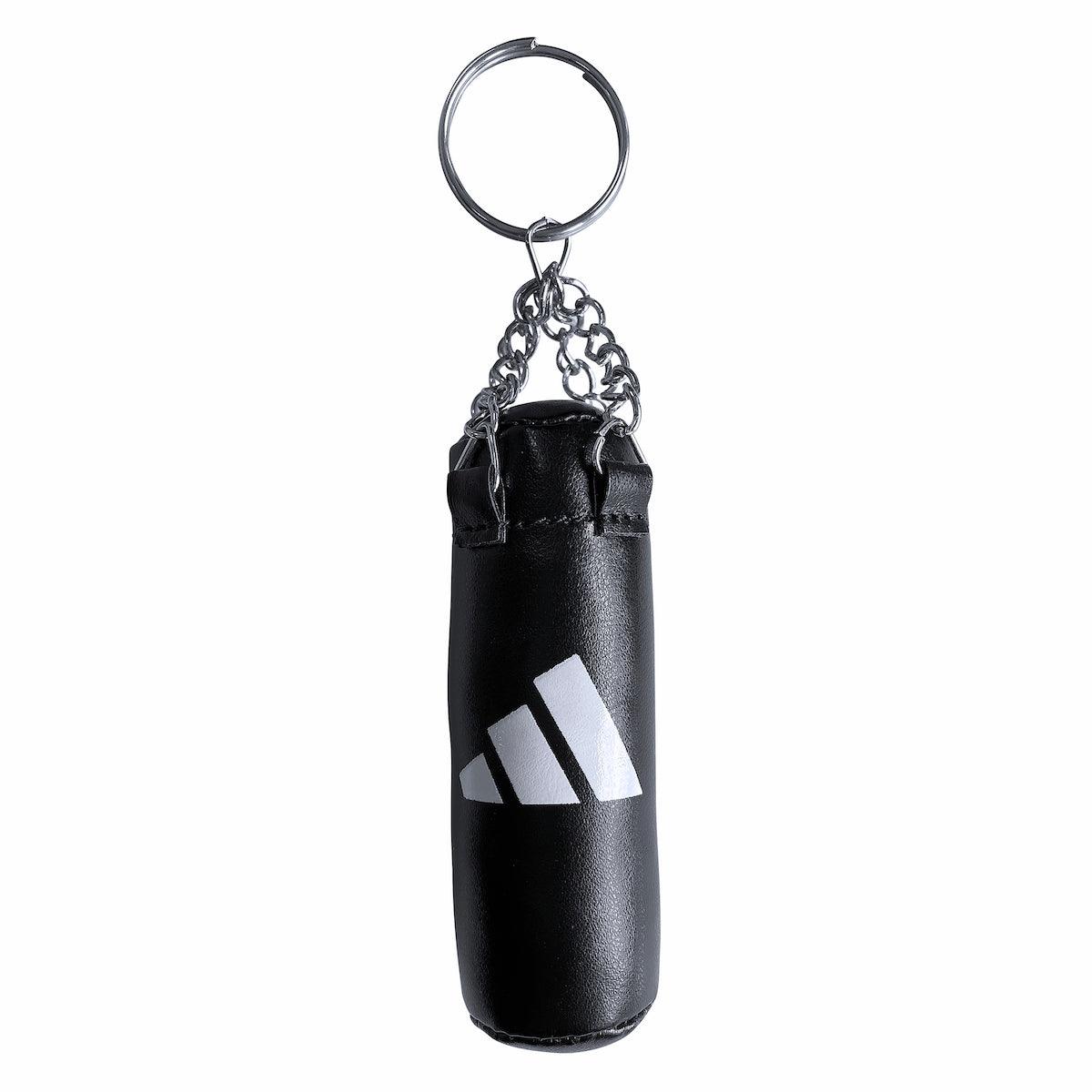 Porte-clés mini Sac de Frappe Adidas noir en PU et mousse, design sac de frappe, accessoire sportif tendance.