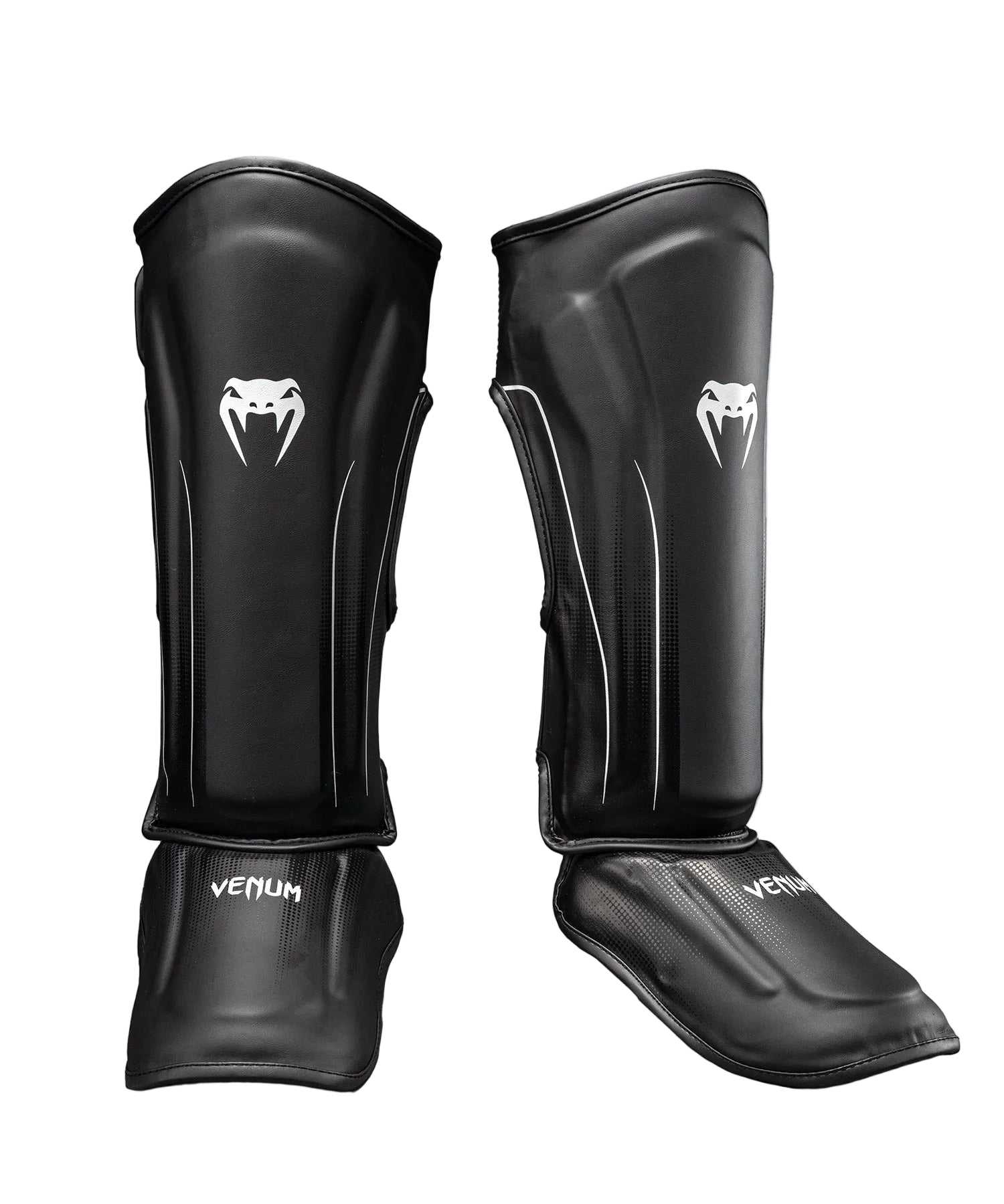 Protège-tibias Venum Stealth noir et blanc pour kickboxing, Muay Thaï et MMA avec mousse multi-densité et triple fixation