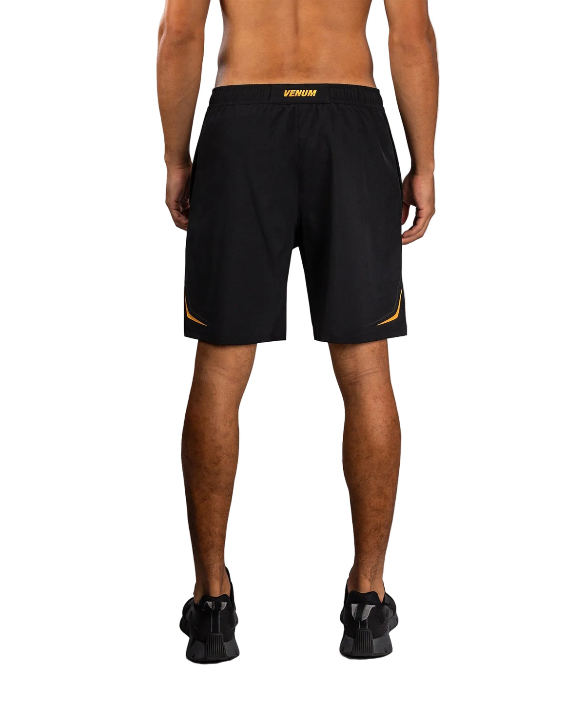 Short d'Entraînement Venum G-Core Noir/Or disponible à la Boutique des Arts Martiaux