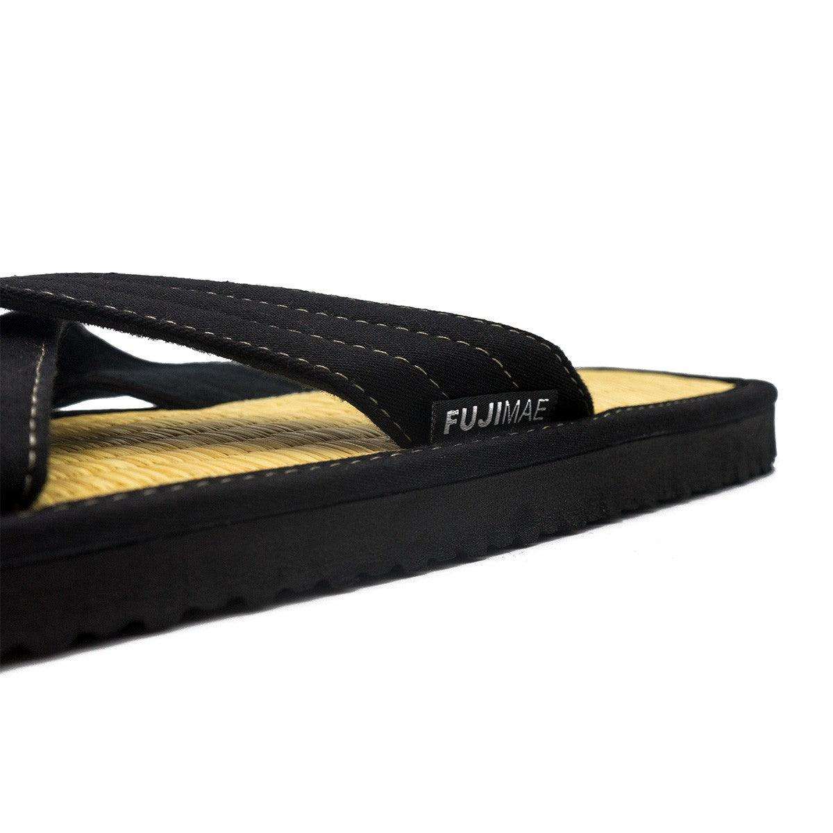 Close-up of Zori FUJIMAE traditional Japanese sandal with black cross straps and rice straw sole designed for martial arts comfort and hygiene