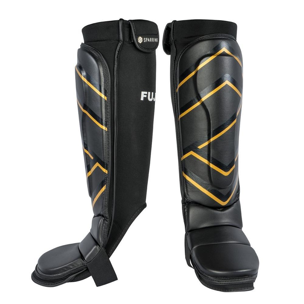 Black FUJIMAE MMA shin and foot guards with yellow geometric accents and velcro straps for secure fit and protection during combat training