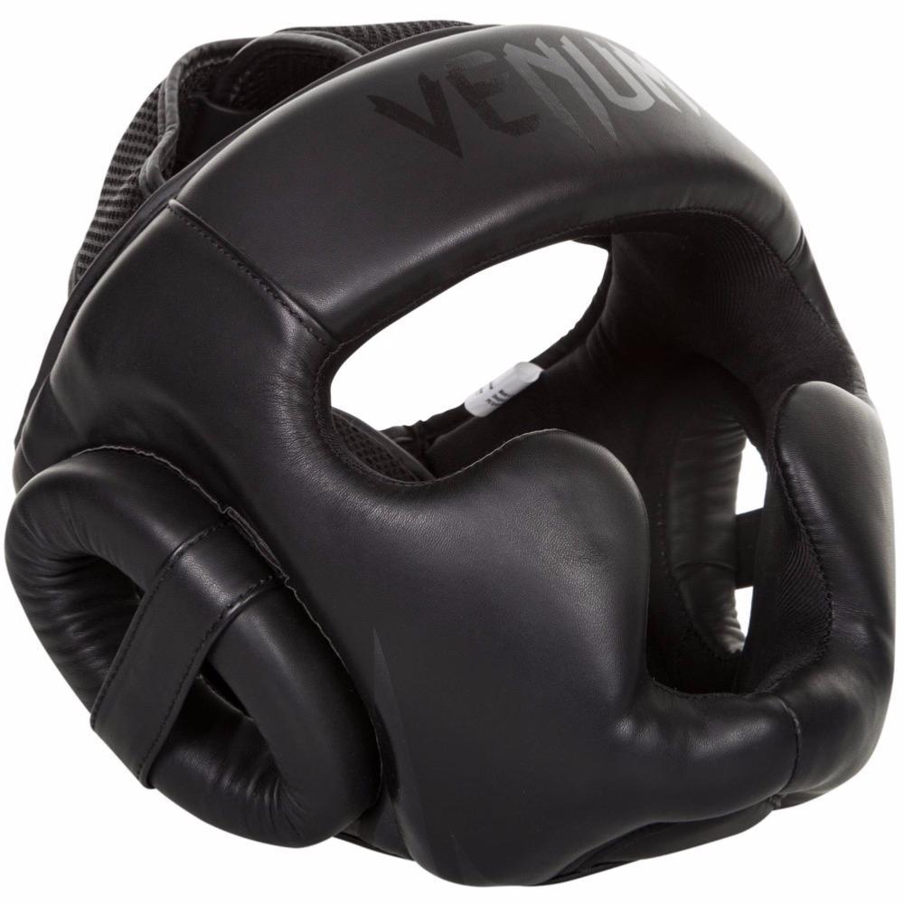 Black Venum Challenger 2.0 boxing headgear made of synthetic leather with triple density foam and Velcro straps for secure fit and optimal protection