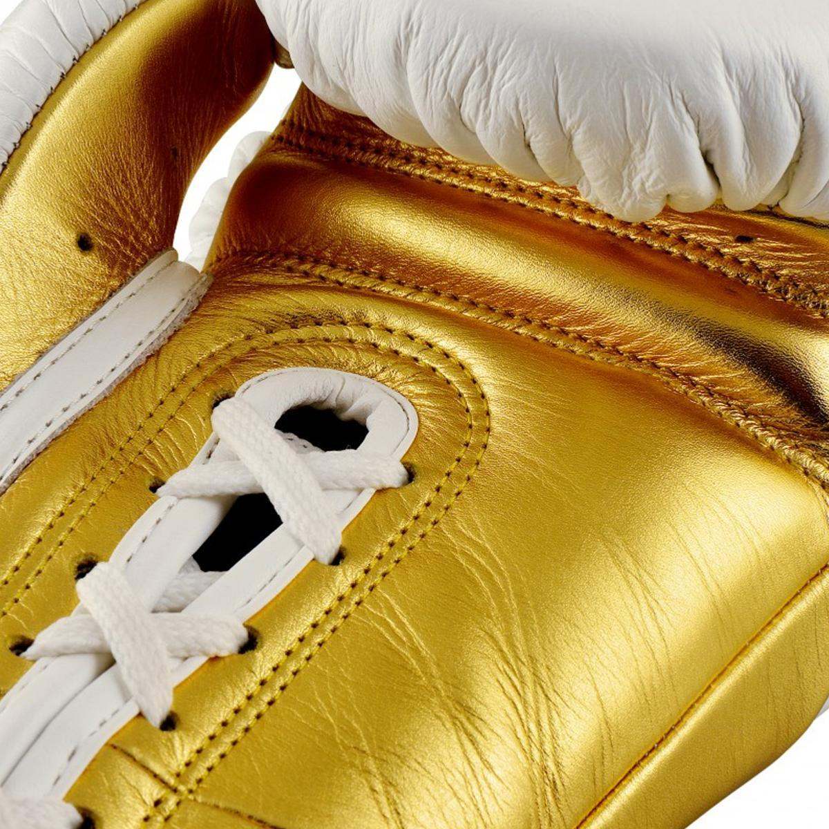 Gants de boxe Pro Adidas Speed Tilt 750 en cuir blanc et or, lacets pour ajustement précis.