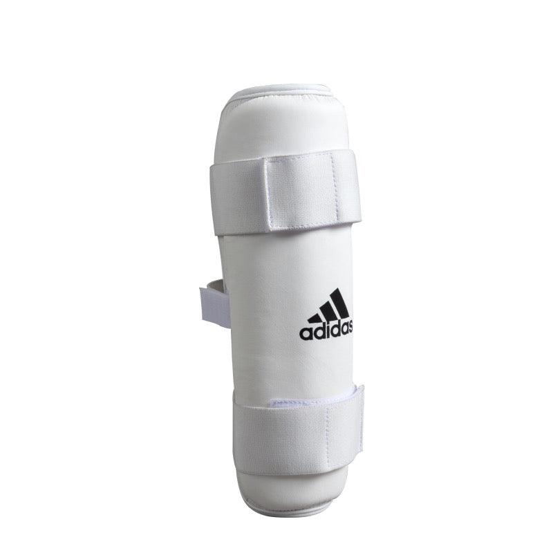 White Adidas PU shin guard with ergonomic design and double-layer EVA foam padding for martial arts protection