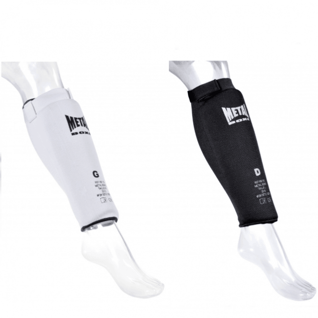 Pair of white and black Metal Boxe MB152 sock-style shin guards with EVA foam cushioning for combat sports protection