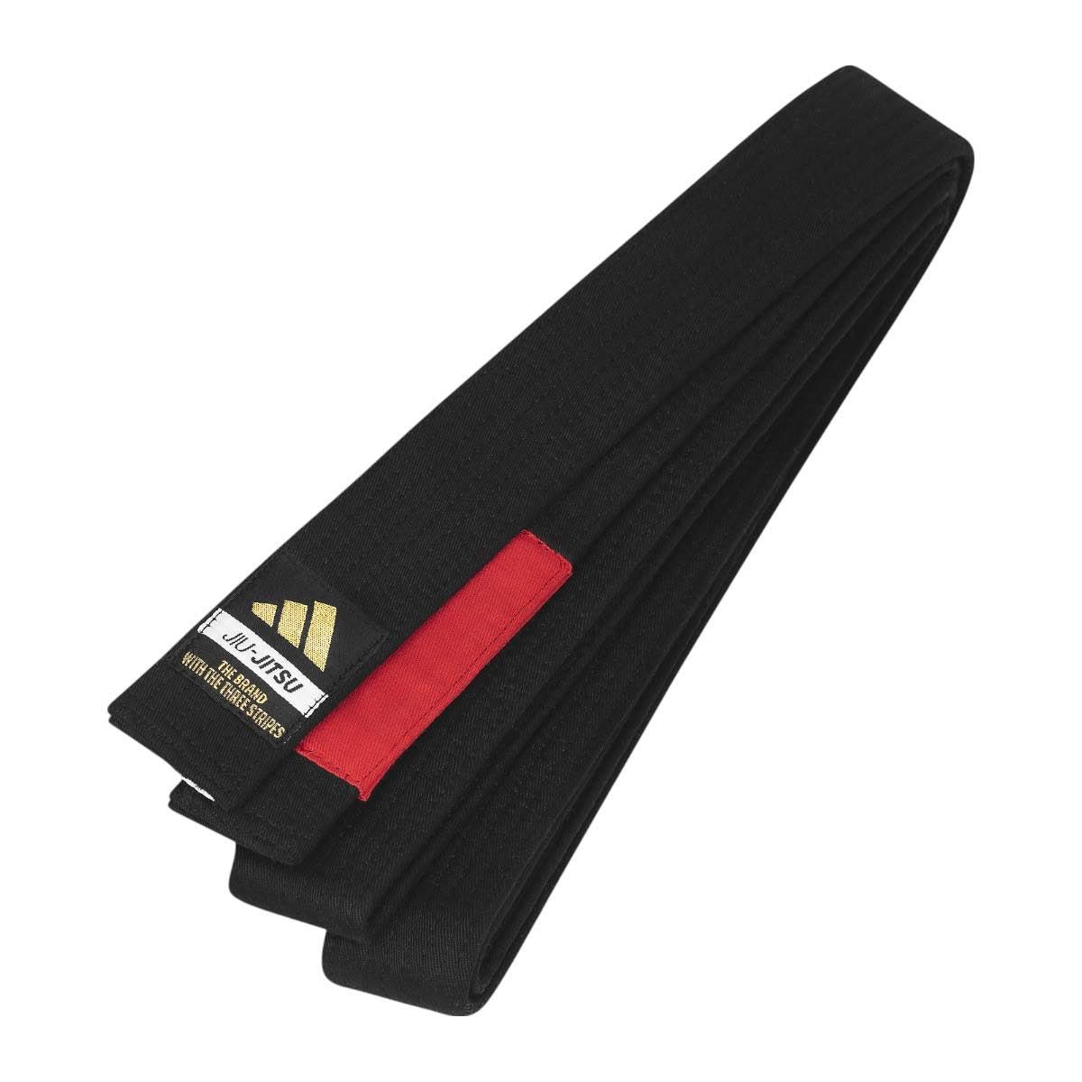 Black Adidas Elite Brazilian Jiu Jitsu belt with gold logo patch and red bar placement strip, durable cotton-polyester blend