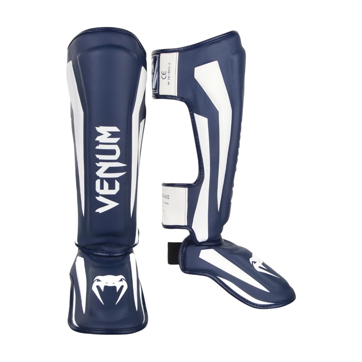 Blue and white Venum Elite shin guards with premium Skintex leather and ergonomic design for Muay Thai and kickboxing protection