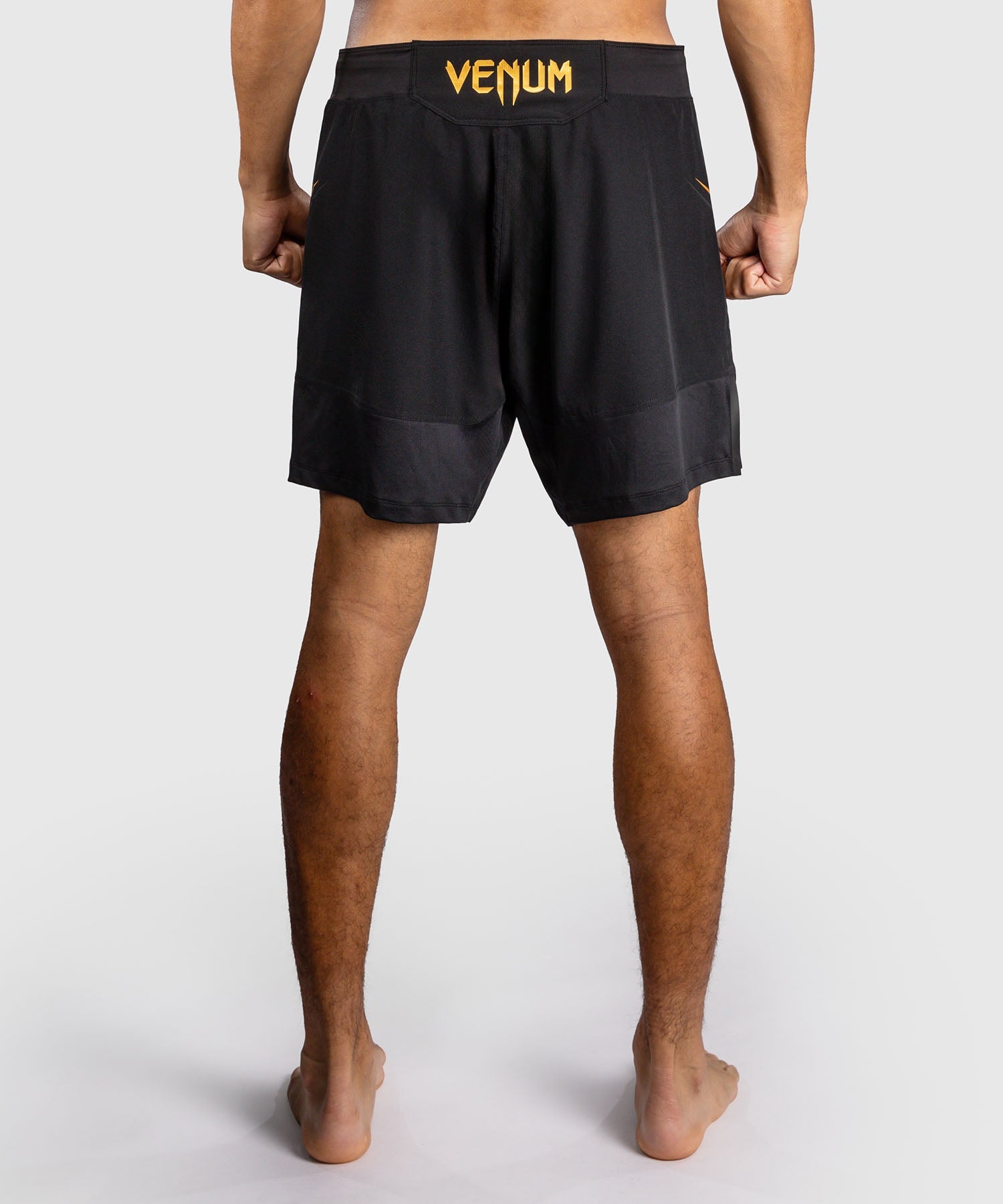 Fightshort Venum G-Core Noir/Or pour l'entraînement