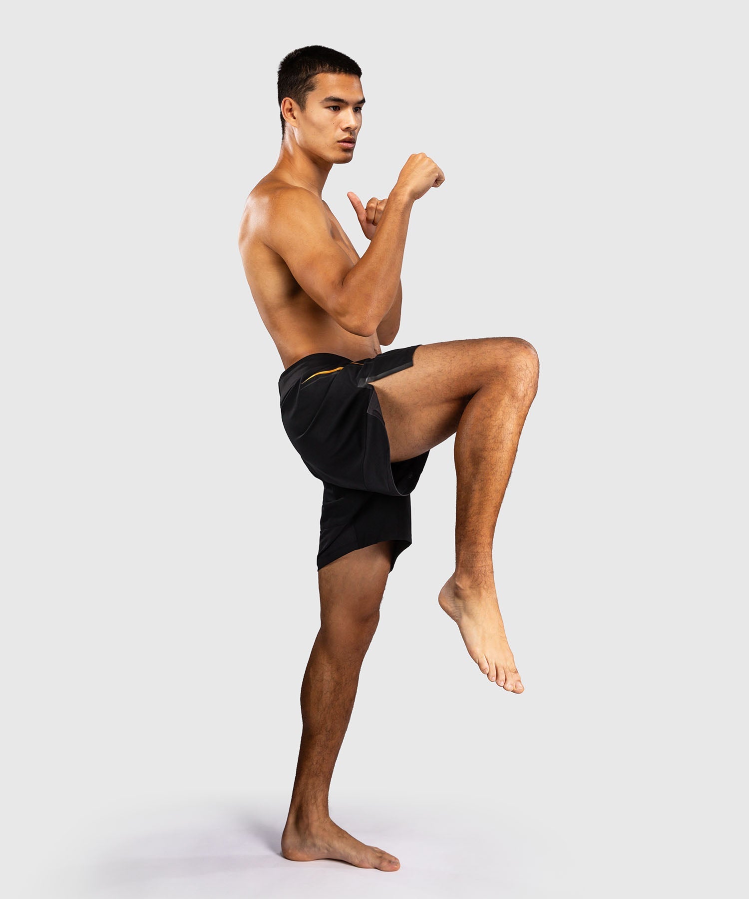 Fightshort Venum G-Core Noir/Or disponible à la Boutique des Arts Martiaux