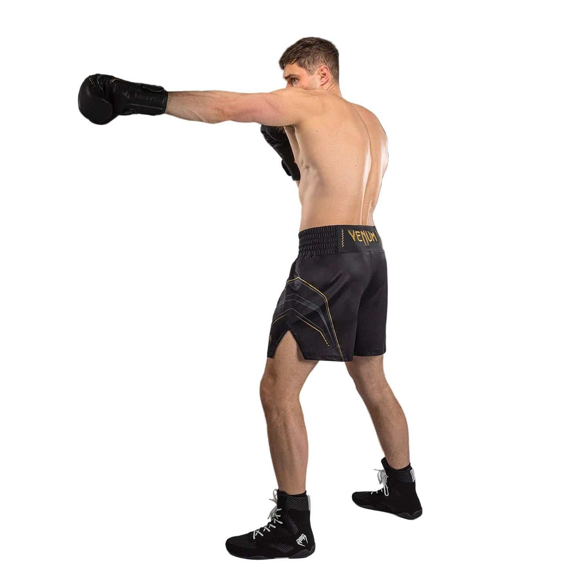Short de boxe anglaise noir en tissu satiné, avec détails dorés et ceinture élastique Venum.